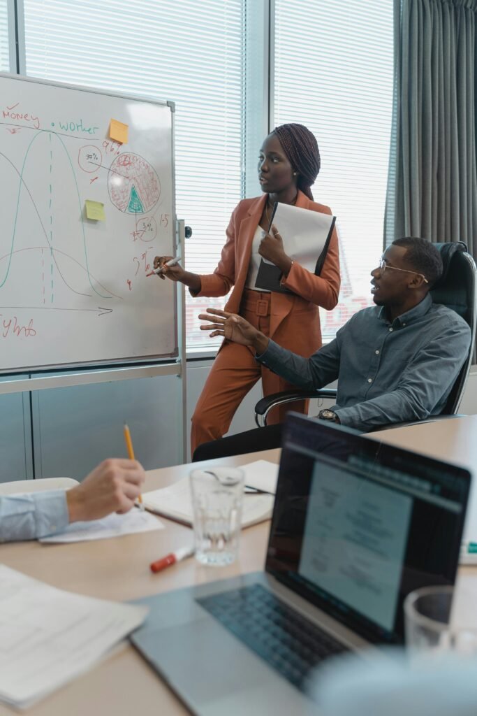 A diverse team discusses strategies during a meeting in a modern office setting.